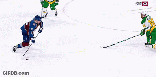 A Hockey Game Is Being Played On A Ice Rink GIF