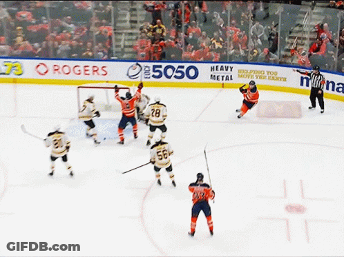 A Hockey Game Is Being Played On A Rink Sponsored By Rogers And Heavy Metal GIF