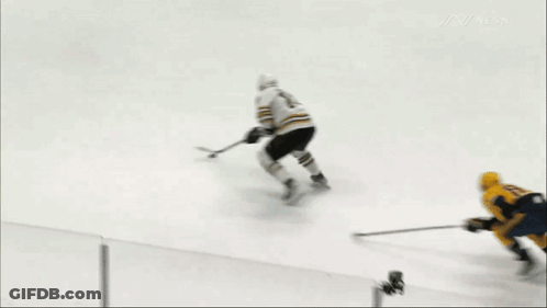 A Hockey Game Is Being Played On A Rink With A Bridgestone Advertisement In The Background GIF