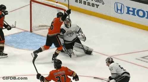 A Hockey Game Is Being Played On A Rink With A Honda Ad In The Background GIF
