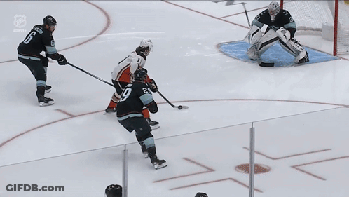 A Hockey Game Is Being Played On A Rink With The Word Son On The Ice GIF