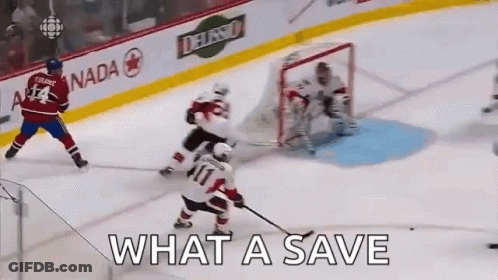 A Hockey Game Is Being Played On A Rink With The Words What A Save Written On The Ice GIF
