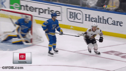 A Hockey Game Is Being Played On A Toyota Sponsored Rink GIF