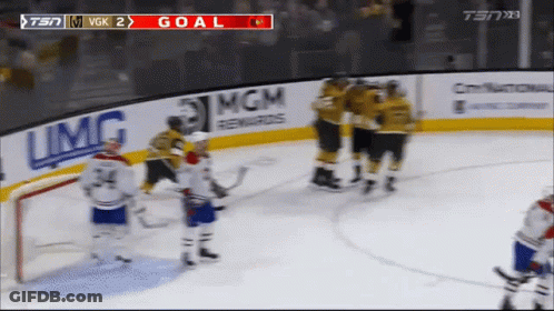 A Hockey Game Is Being Played On A Tv Screen GIF
