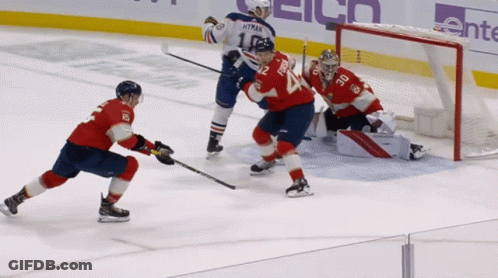 A Hockey Game Is Being Played With A Goalie Wearing Number 24 GIF