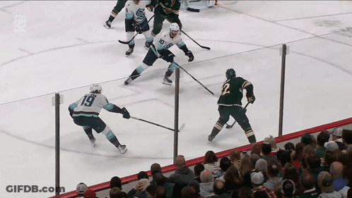 A Hockey Game Is Being Played With A Player Wearing Number 19 GIF
