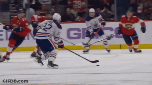 A Hockey Game Is Being Played With A Player Wearing The Number 27 On His Jersey GIF