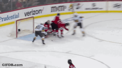 A Hockey Game Is Being Played With Ads For Prudential And Verizon GIF