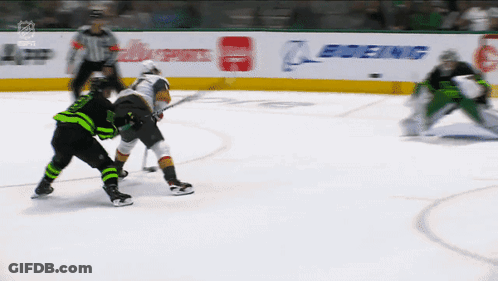 A Hockey Game Is Underway With A Boeing Banner In The Background GIF