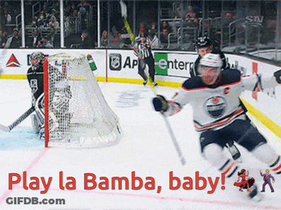 A Hockey Game With The Words Play La Bamba Baby On The Ice GIF