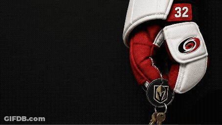A Hockey Glove With The Number 32 On It Is Hanging On A Key Chain GIF