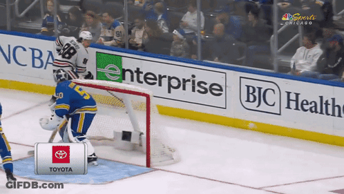 A Hockey Goalie Stands In Front Of A Toyota Sign GIF