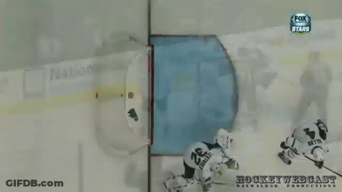 A Hockey Goalie Wearing A Helmet With The Letters Fox On It GIF