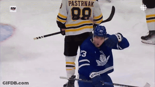 A Hockey Player Has The Number 99 On His Back GIF