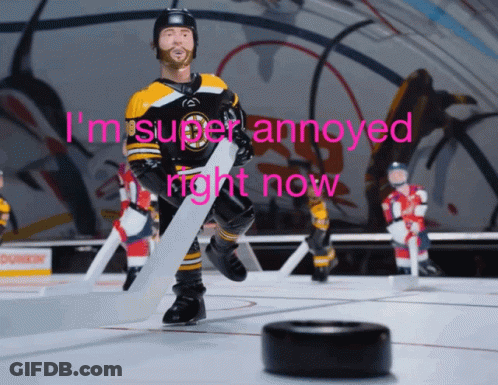 A Hockey Player Holding A Puck With The Words I 'M Super Annoyed Right Now GIF