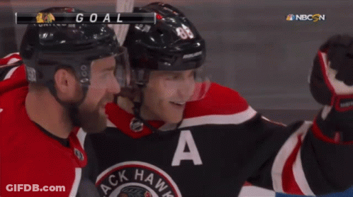 A Hockey Player In A Black And Red Jersey With The Letter A On It GIF