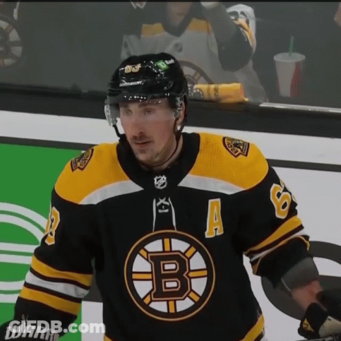 A Hockey Player In A Black And Yellow Jersey With The Letter B On It GIF