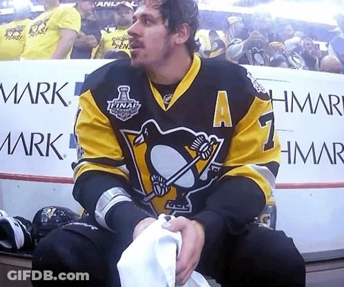 A Hockey Player In A Black And Yellow Jersey With The Number 7 On It GIF