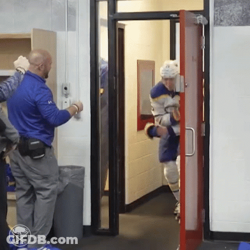 A Hockey Player In A Blue Jersey With The Number 10 GIF