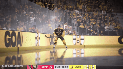 A Hockey Player In A Bruins Jersey Stands On The Ice GIF