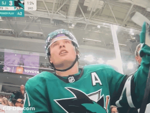 A Hockey Player In A Green Jersey With The Letter A On The Front GIF