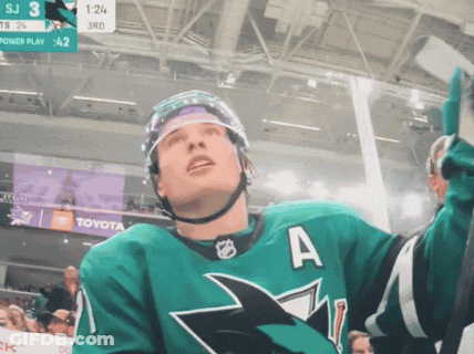 A Hockey Player In A Green Jersey With The Letter A On The Front GIF