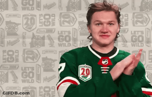 A Hockey Player In A Green Jersey With The Number 20 On It GIF