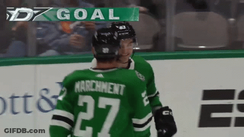 A Hockey Player In A Green Jersey With The Number 27 GIF