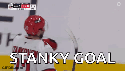 A Hockey Player In A Red Helmet Is Celebrating A Stanky Goal . GIF