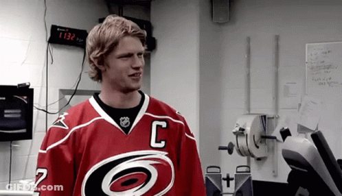 A Hockey Player In A Red Jersey With The Letter C On It GIF