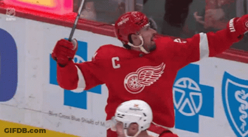 A Hockey Player In A Red Jersey With The Letter C On The Front GIF