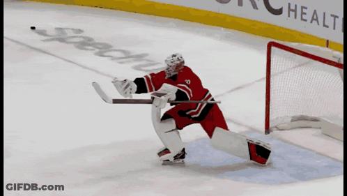 A Hockey Player In A Red Jersey With The Number 10 On It GIF