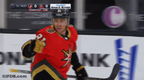 A Hockey Player In A Red Jersey With The Number 21 On It GIF