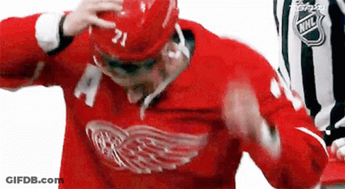 A Hockey Player In A Red Jersey With The Number 21 On It GIF