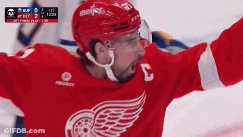 A Hockey Player In A Red Jersey With The Number 3 On It GIF