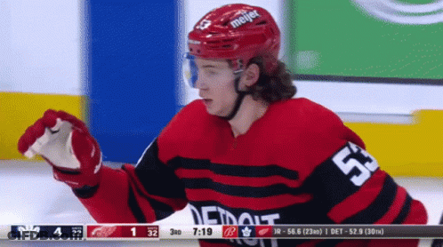 A Hockey Player In A Red Jersey With The Number 53 On It GIF