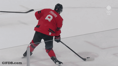A Hockey Player In A Red Jersey With The Number 8 On It GIF