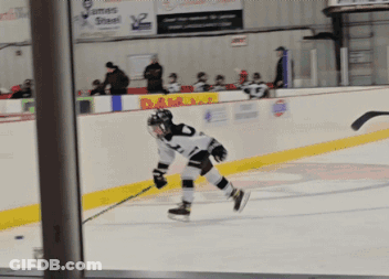 A Hockey Player In A White Jersey With The Number 2 On It Is Skating On The Ice GIF