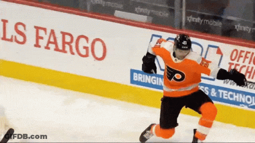 A Hockey Player In Front Of A Fargo Sign GIF