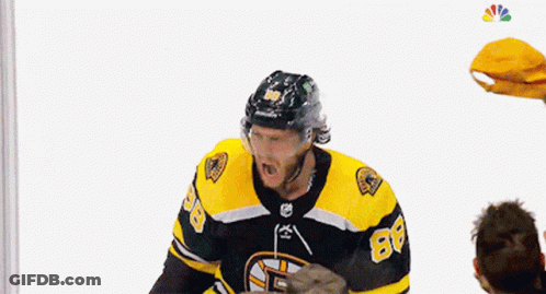 A Hockey Player Is Being Thrown In The Air By A Crowd GIF
