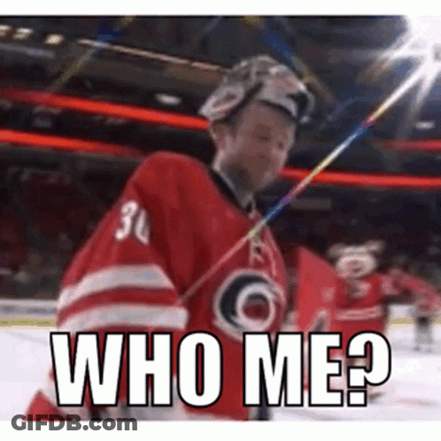 A Hockey Player Is Holding A Stick And Says Who Me . GIF