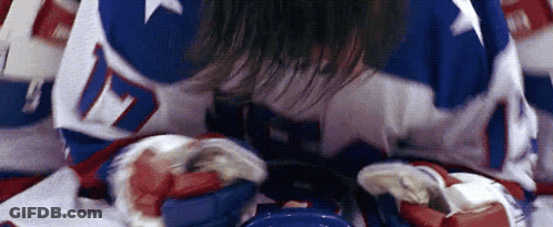 A Hockey Player Is Laying On The Ice With The Number 17 On His Jersey GIF