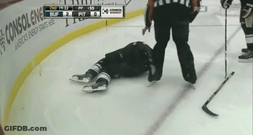 A Hockey Player Is Laying On The Ice With The Scoreboard Showing 2Nd 19:33 Buff 2 Pit GIF