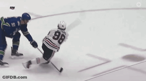 A Hockey Player Is Laying On The Ice With The Sn Logo On The Bottom Right GIF