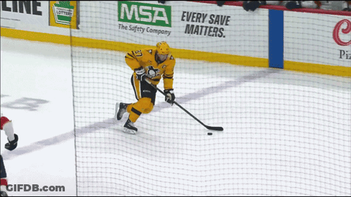 A Hockey Player Is On The Ice With A Msa Advertisement Behind Him GIF