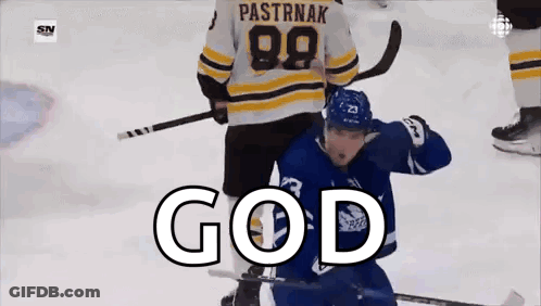 A Hockey Player Is Standing On The Ice With The Word God Written On The Screen . GIF