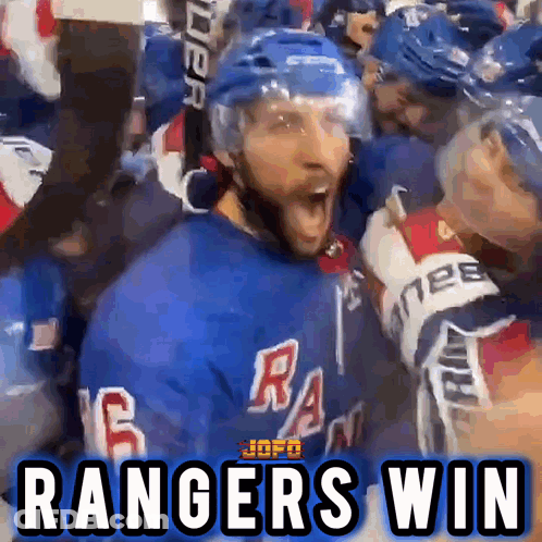 A Hockey Player Is Surrounded By His Teammates And Says " Rangers Win " GIF