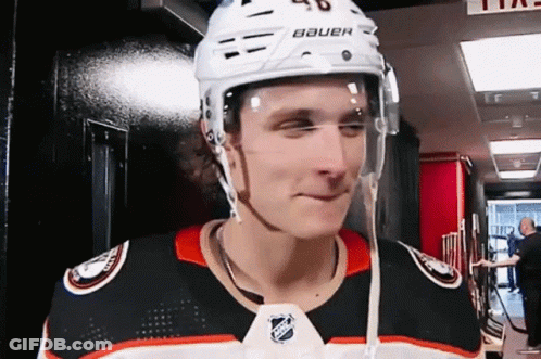 A Hockey Player Is Wearing A Helmet That Says Bauer GIF