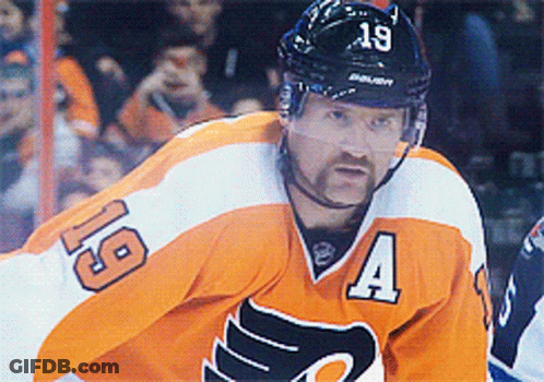 A Hockey Player Is Wearing A Jersey With The Number 19 On It GIF