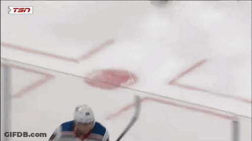 A Hockey Player Is Wearing A Rangers Jersey And Holding A Stick GIF